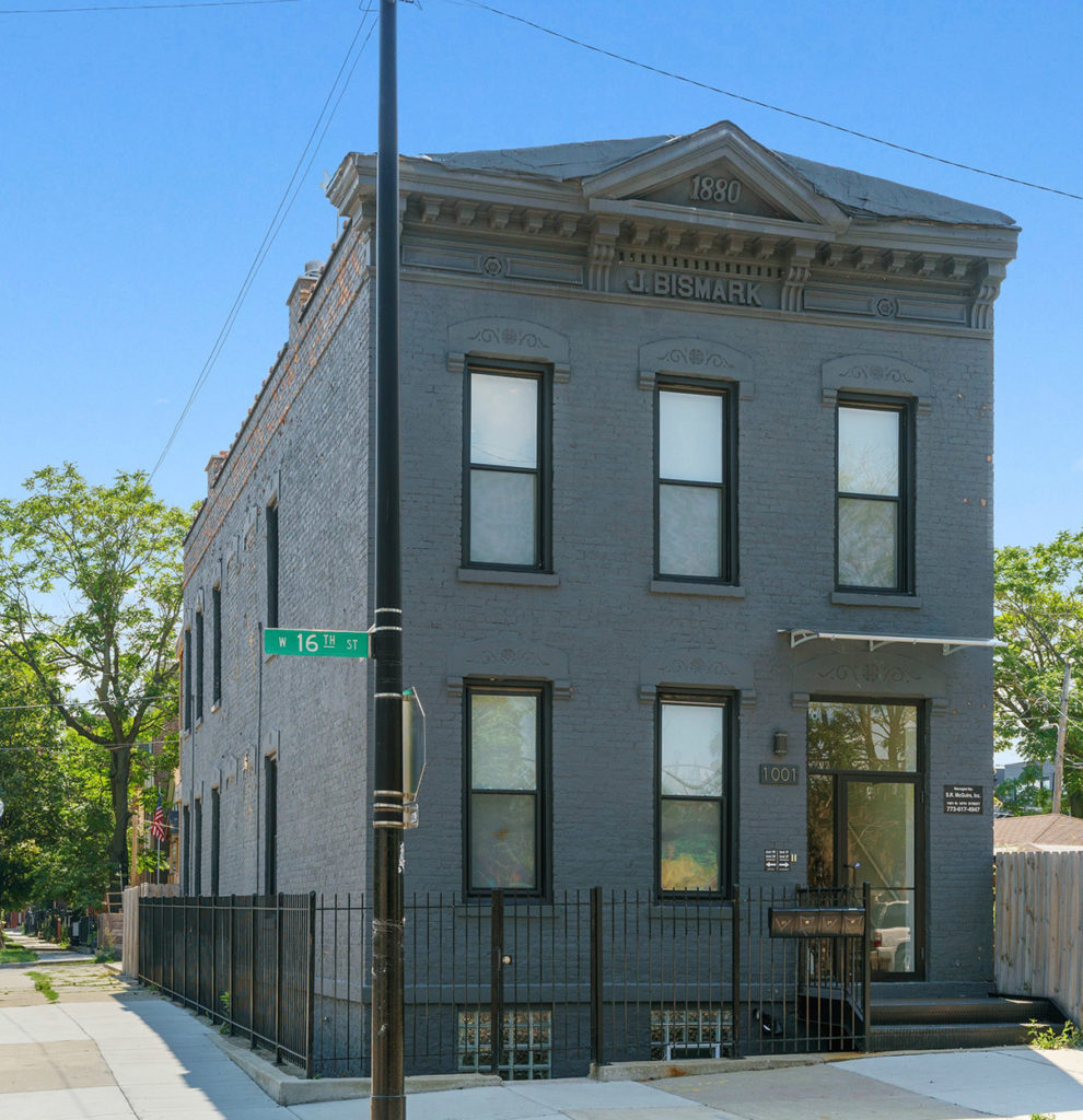 Photo of a blue brick home in Chicago's Pilsen neighborhood